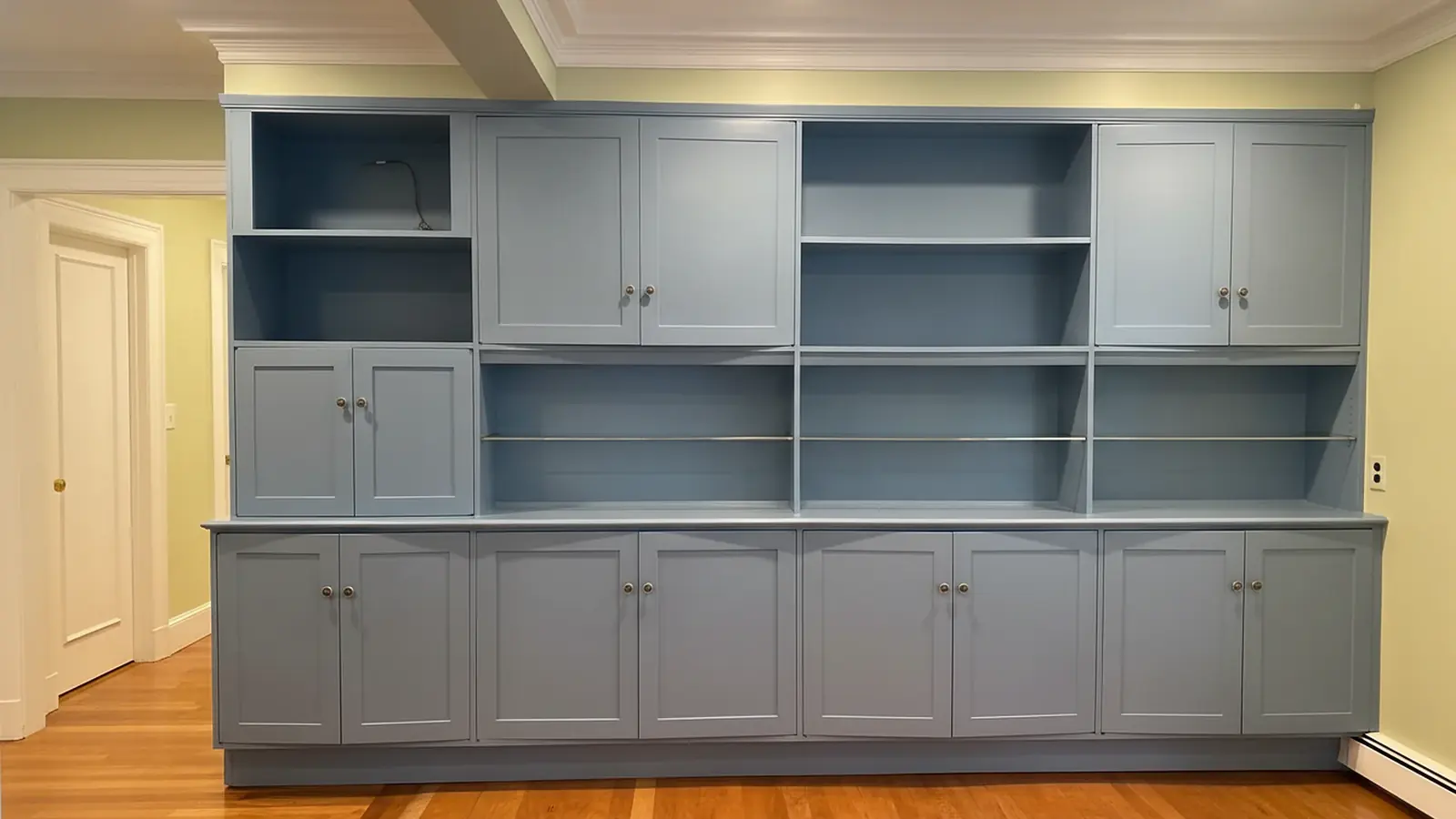 Built-in wall cabinets painted blue