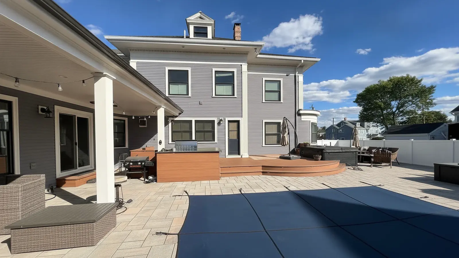 Gray house exterior with white trim and clean gutter lines