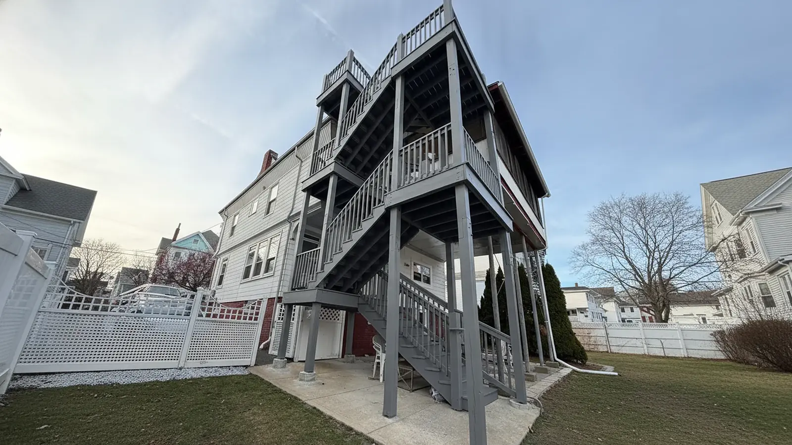 Triple-decker porches painted gray and white