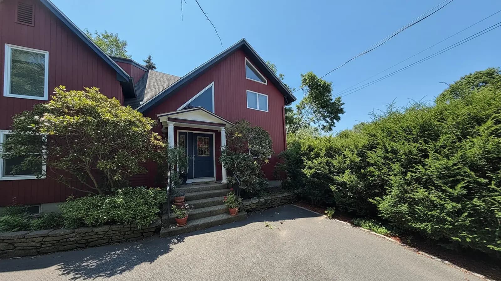 Red cape house exterior with navy door
